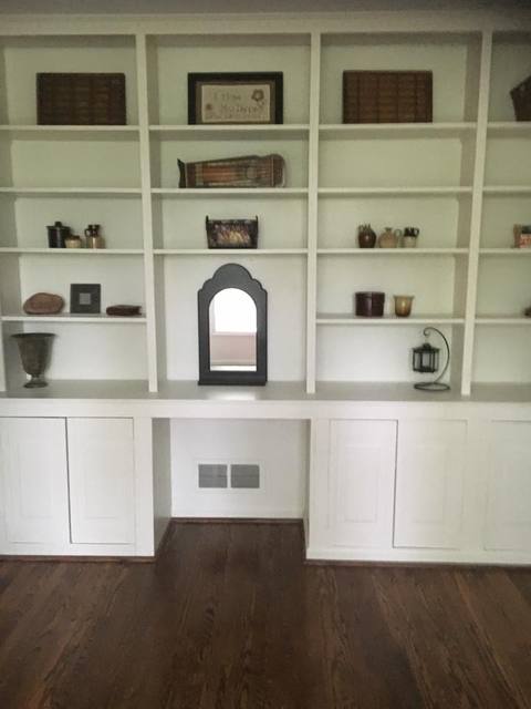 Transitional Library with dark wood floor
