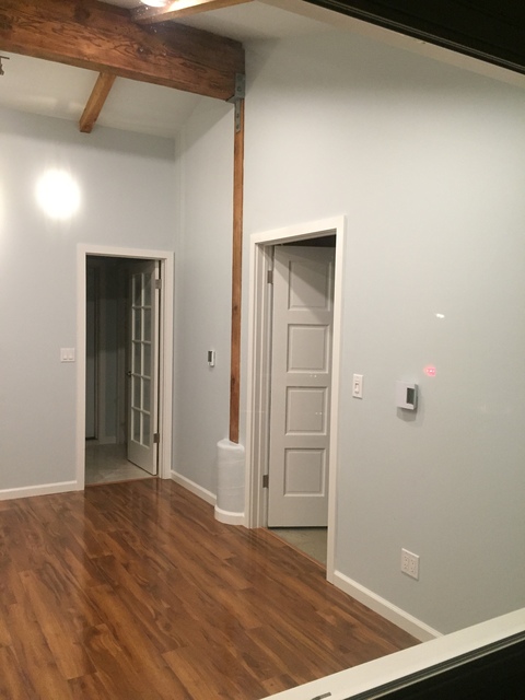 Contemporary Garage with eight plus panel doors