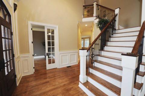 Traditional Entry with dark wood front door with clerestory windows