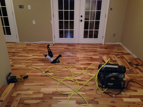 Transitional Dining Room with variegated wood floor