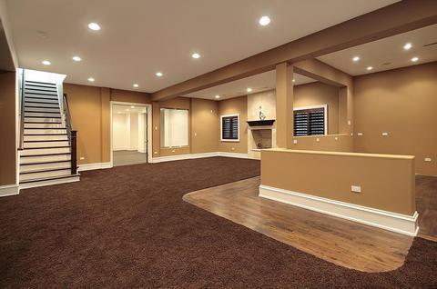 Contemporary Basement with block wood newel post