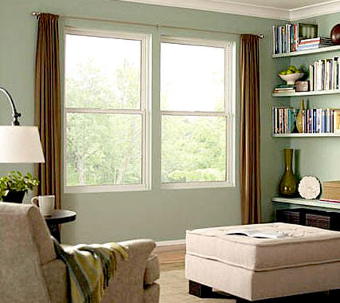 Transitional Library with light teal green painted walls