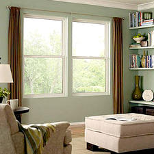 Transitional Library with light teal green painted walls