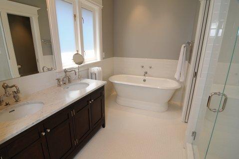 Transitional Bathroom with half white subway tiled bathroom wall