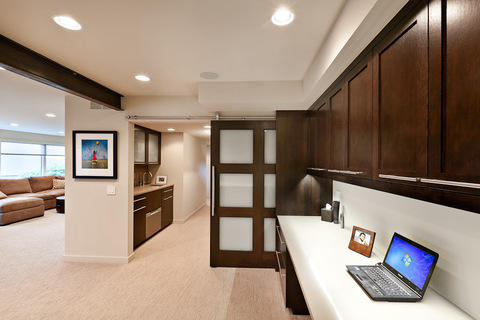 Contemporary Home Office with built in shaker style cabinets