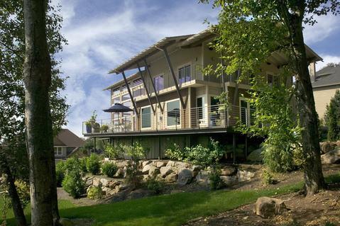 Modern Home Exterior with boulder retaining wall