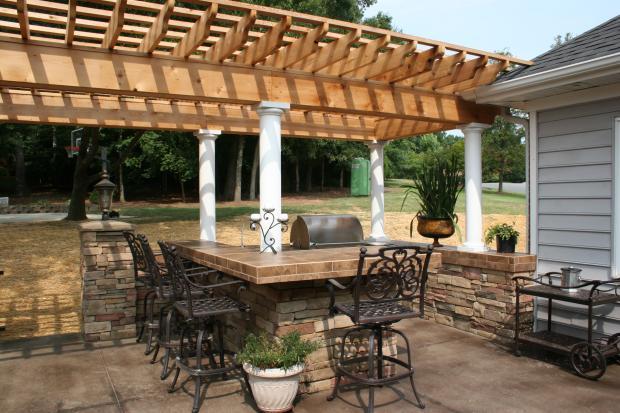 Tuscan Patio with stone pillar outdoor lighting post