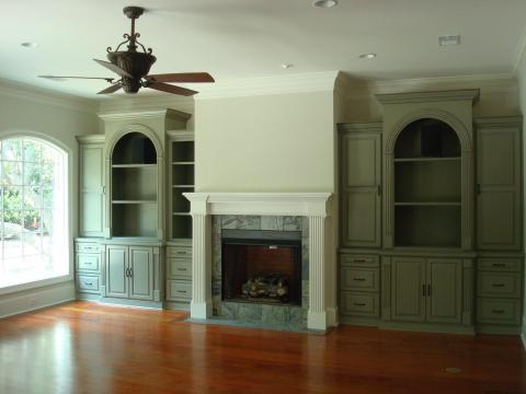 Traditional Family Room with light gray marble fire place facing