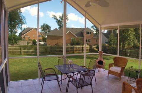 Traditional Sunroom with iron patio furniture