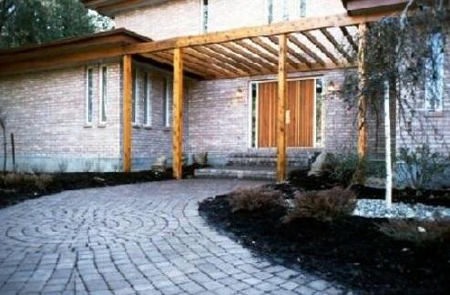 Contemporary Patio with stained wood front door