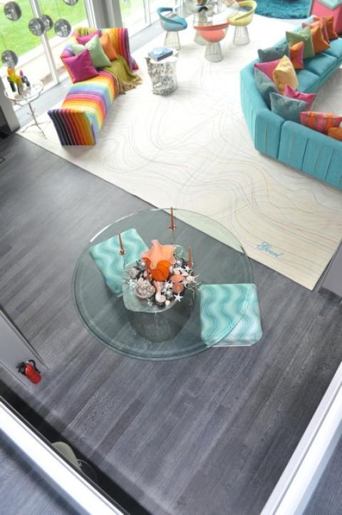 Contemporary Family Room with glass round top dining table with silver tree trunk base