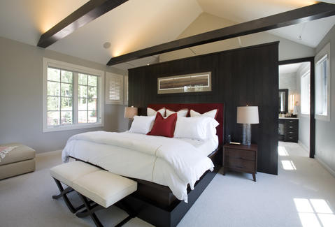 Contemporary Bedroom with stained wood wall paneling