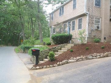 Flower beds with rock border and walkway. Pictures and Photos