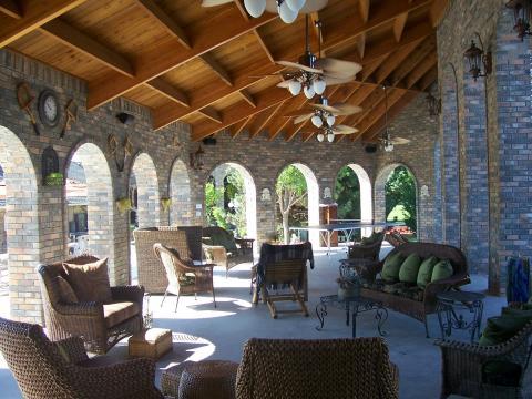 Traditional Patio with dark brown wicker patio furniture