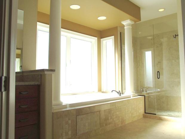 Transitional Master Bathroom with glass shower stall doors