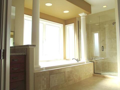 Transitional Master Bathroom with glass shower stall doors