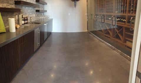 Contemporary Wine Cellar with frameless glass doors