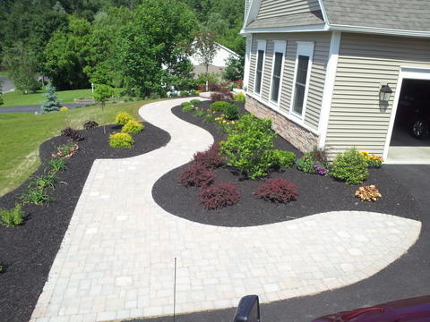 Transitional Landscape with light grey painted siding
