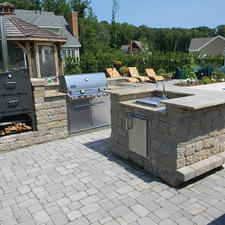 Transitional Landscape with stone paver patio