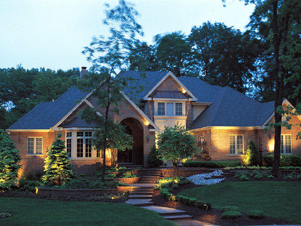 Traditional Landscape with brick terraced yard