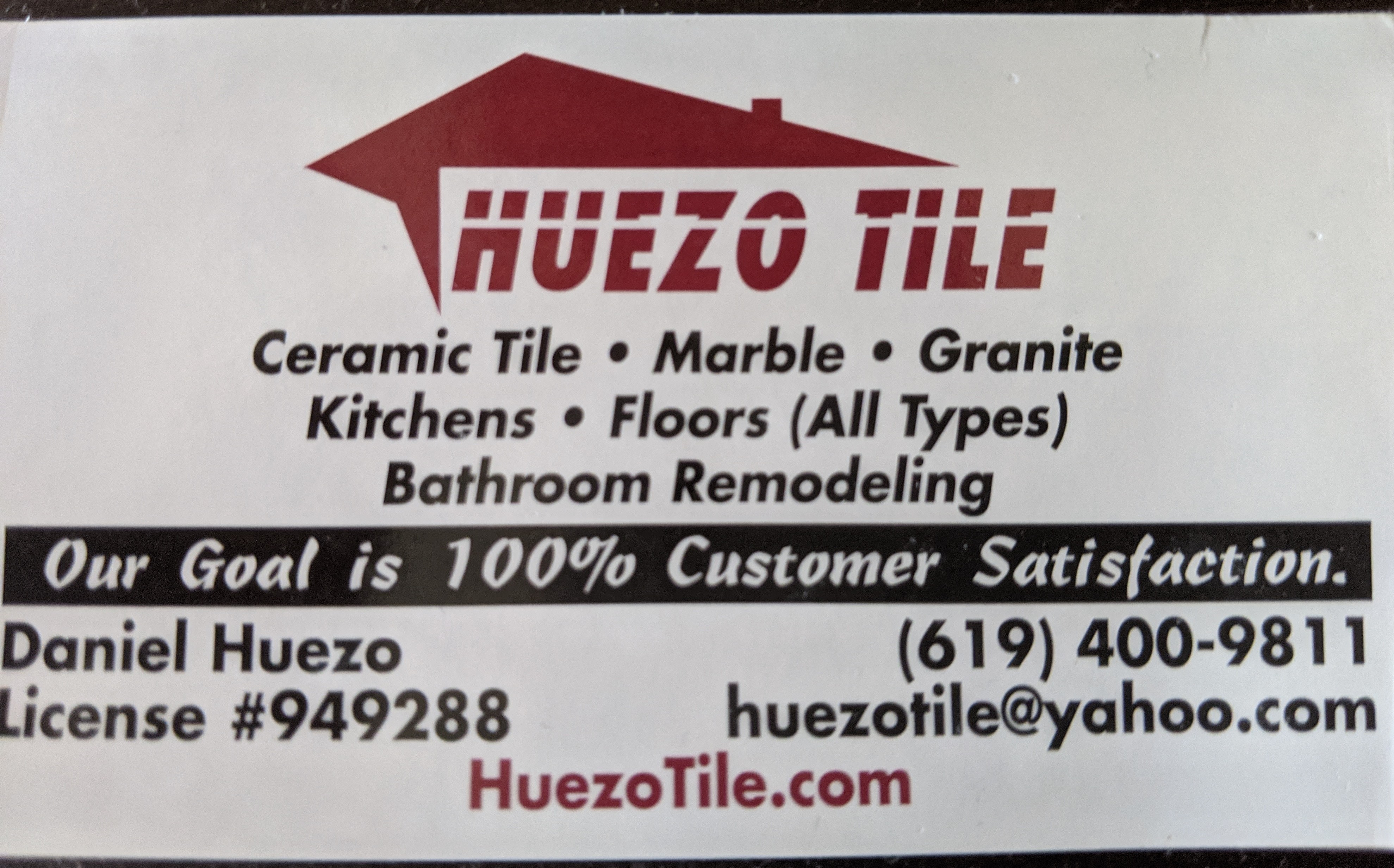 Huezo Tile & Marble Logo