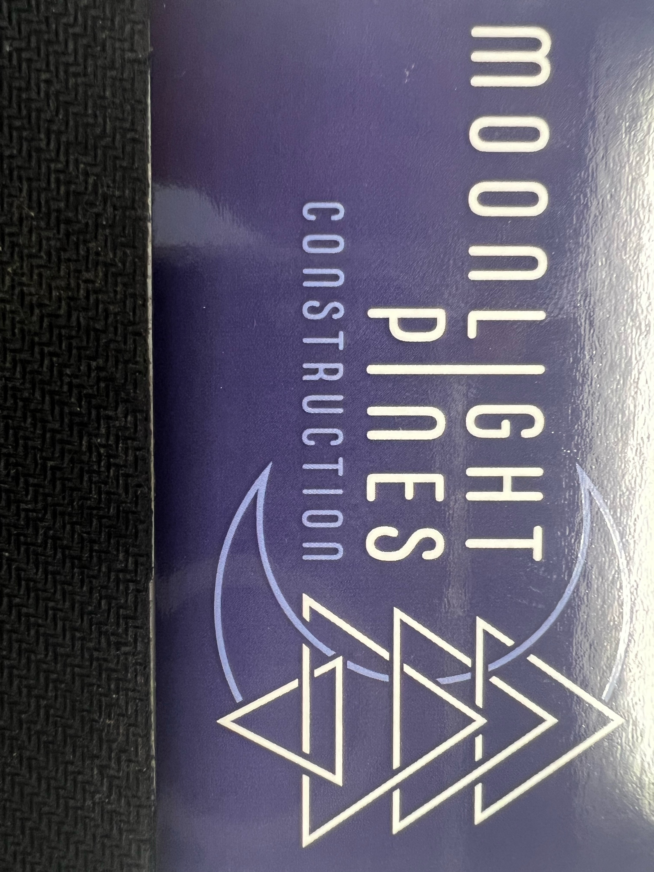 Moonlight Pines Construction Logo