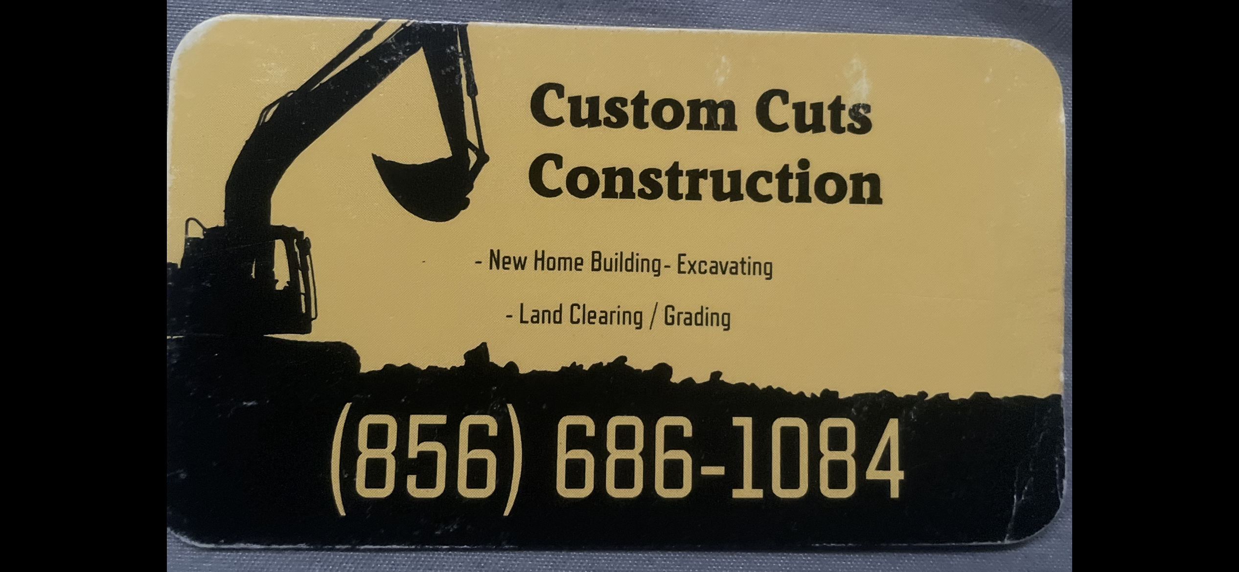 Custom Cuts Construction Logo