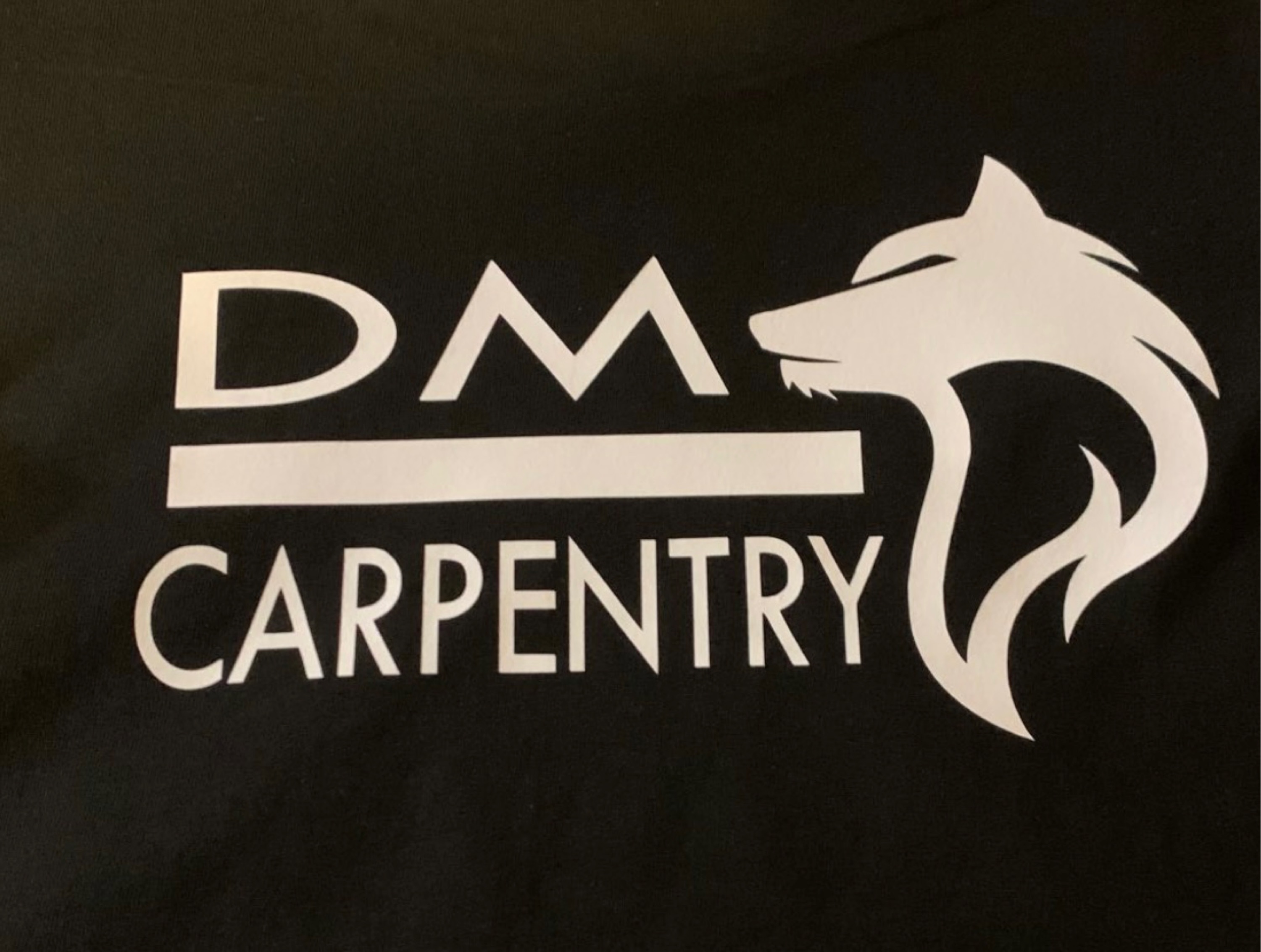 DM Carpentry-Unlicensed Contractor Logo