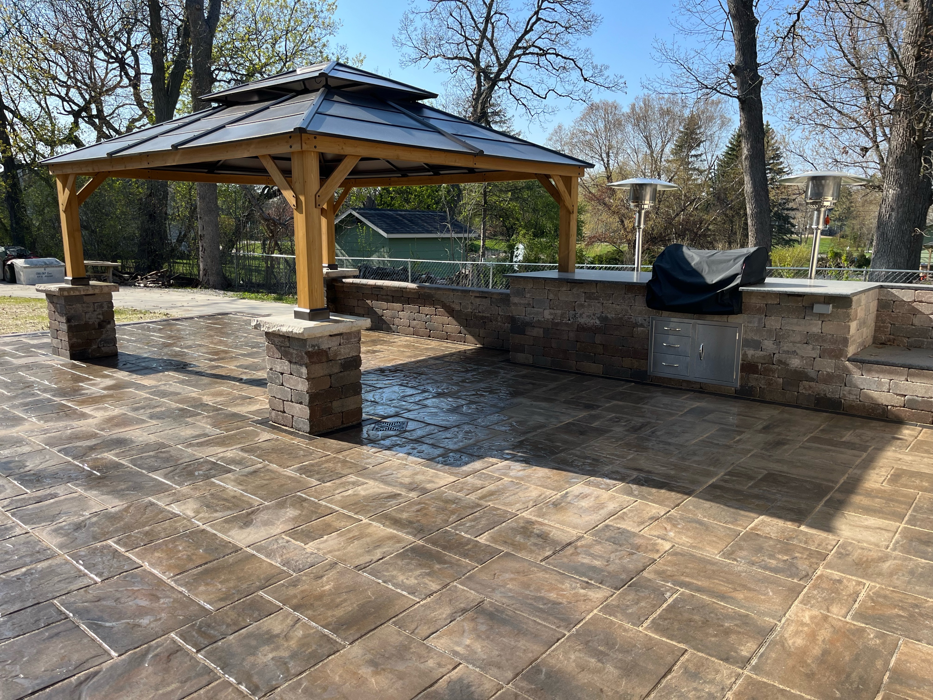 Over the Top Hardscape & Landscape Logo