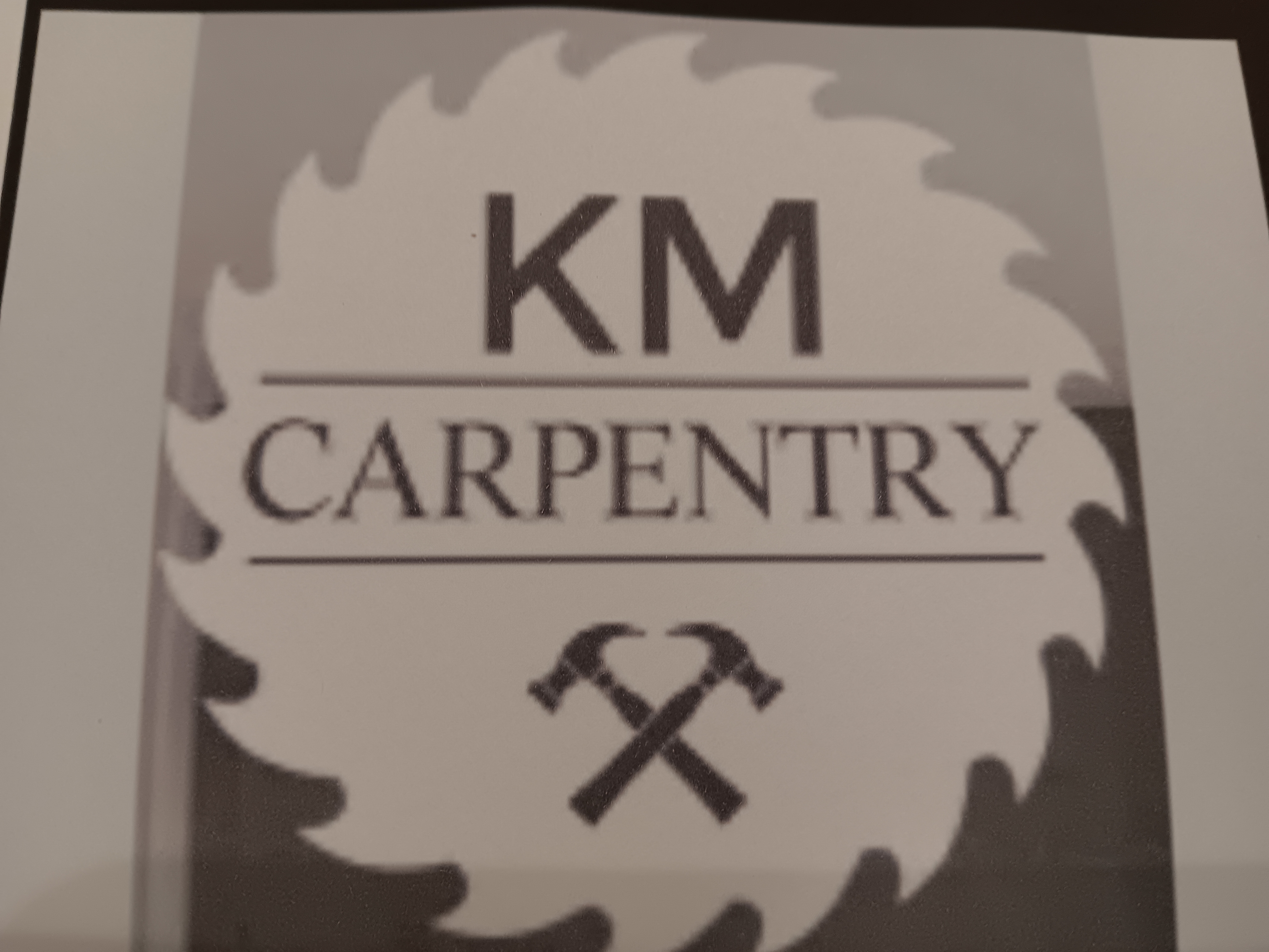 KM Carpentry Logo