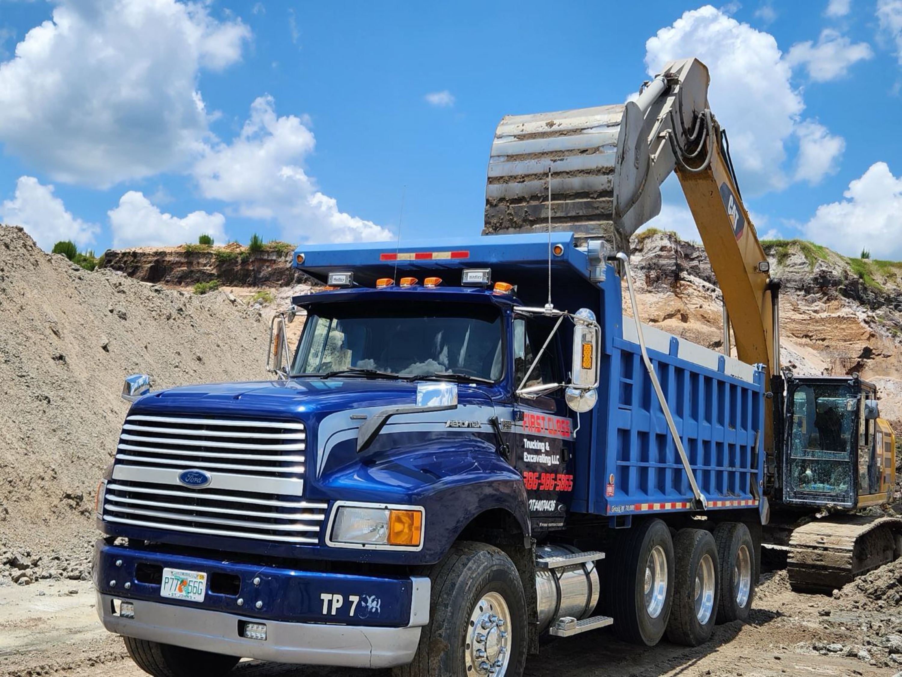 First Class Trucking & Excavating, LLC Logo