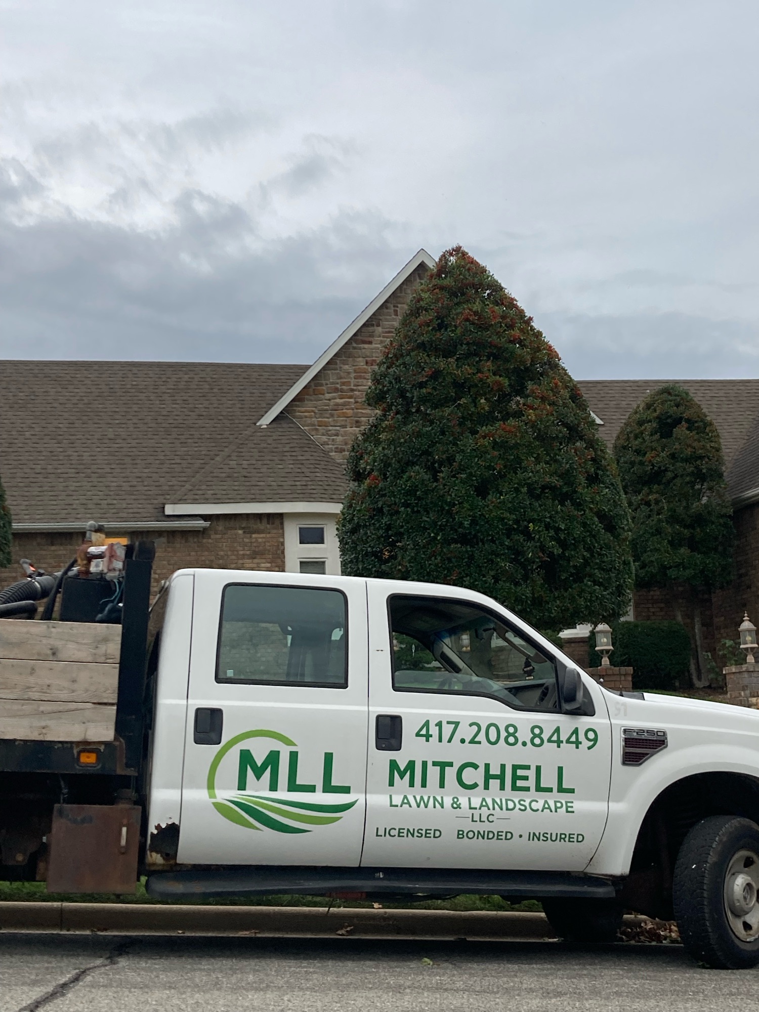 Mitchell Lawn & Landscape, LLC Logo