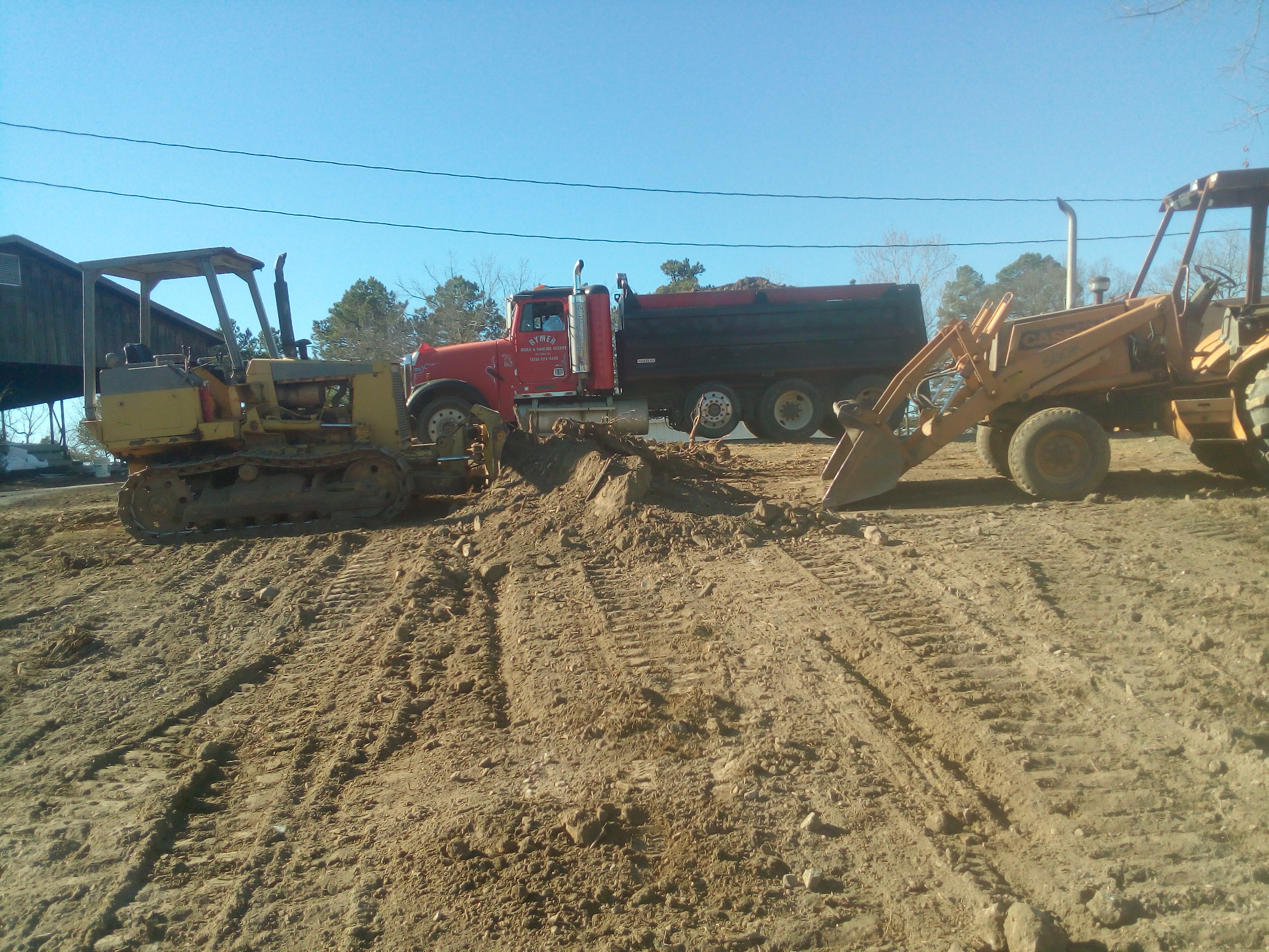 Rymer Dozer & Backhoe Service, Inc. Logo