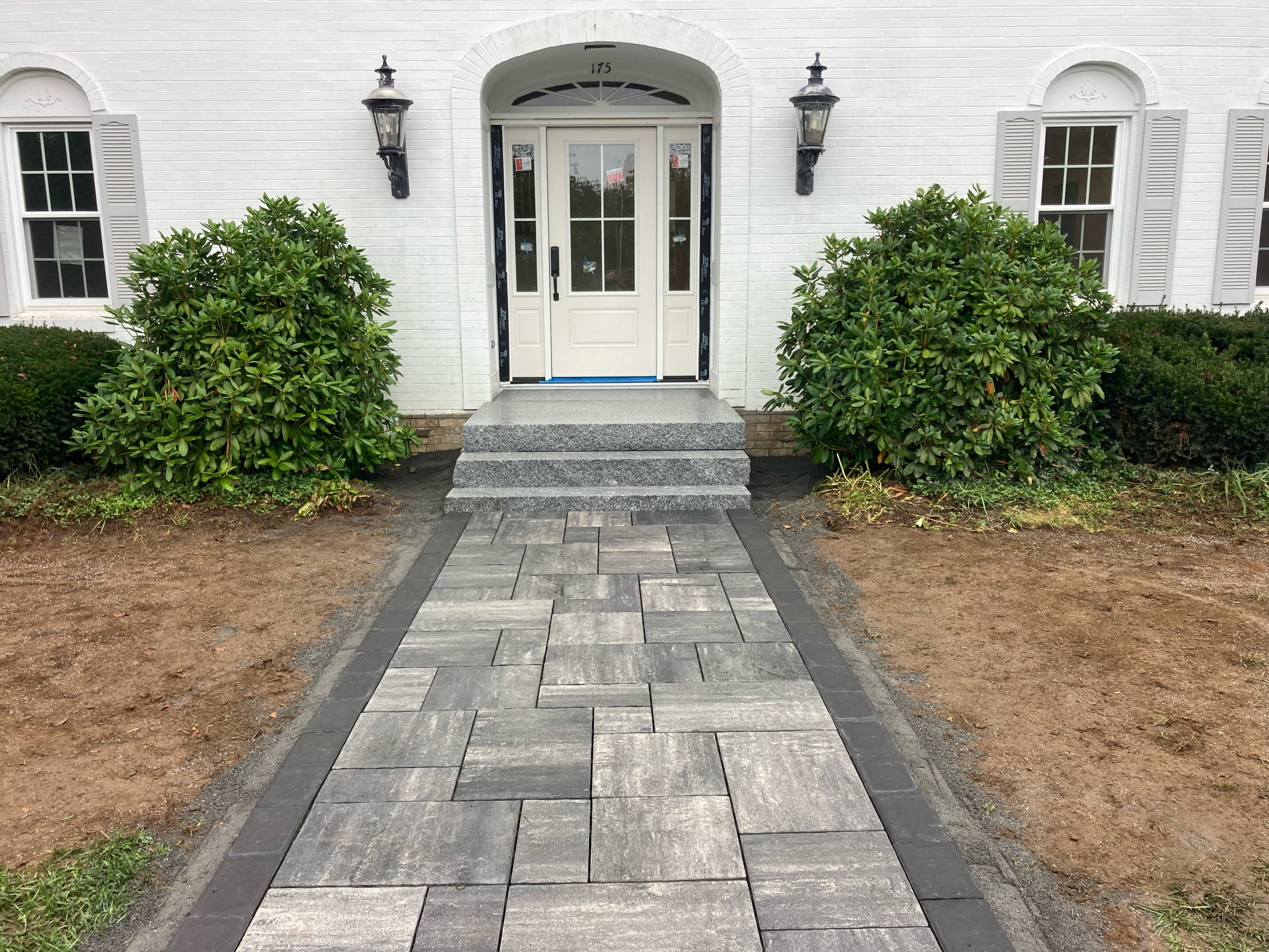 M. W. Towle Landscaping Logo