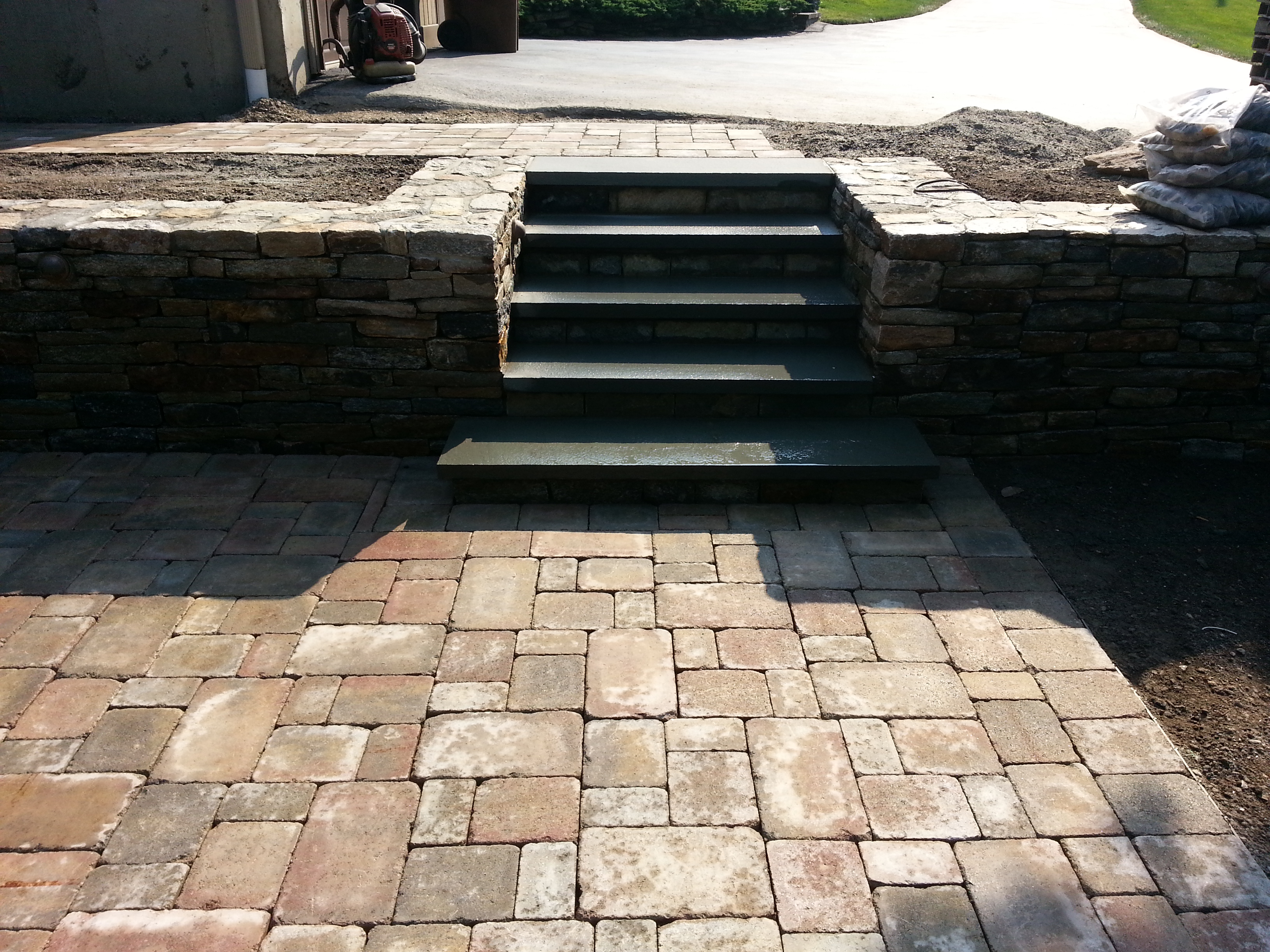 Manny Masonry & Landscaping, LLC Logo