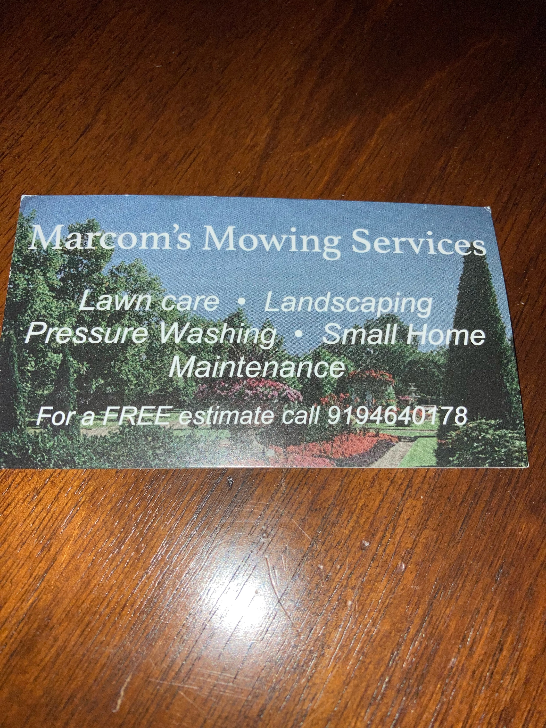 Marcom's Mowing Service Logo