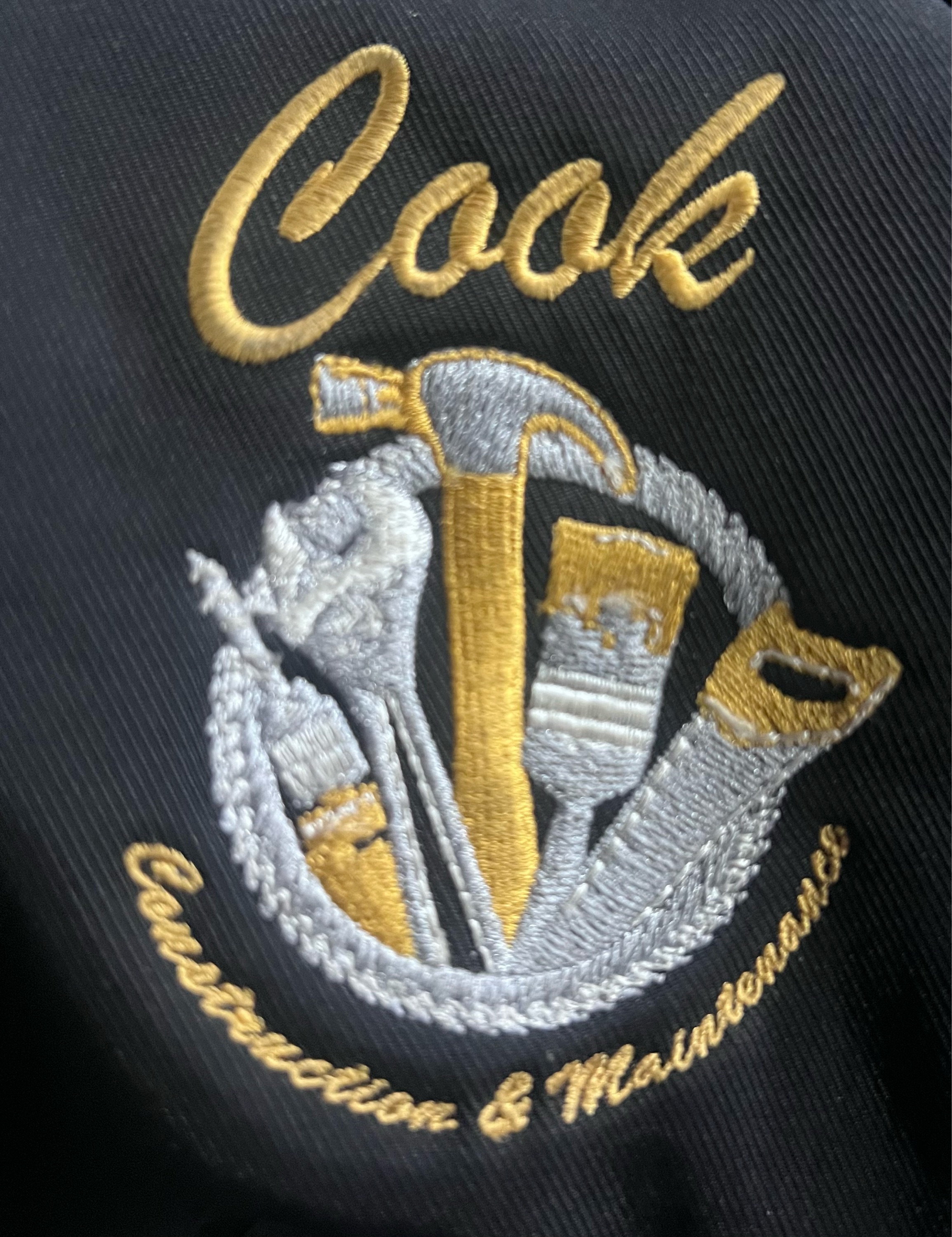 Cook Construction and Maintenance Logo