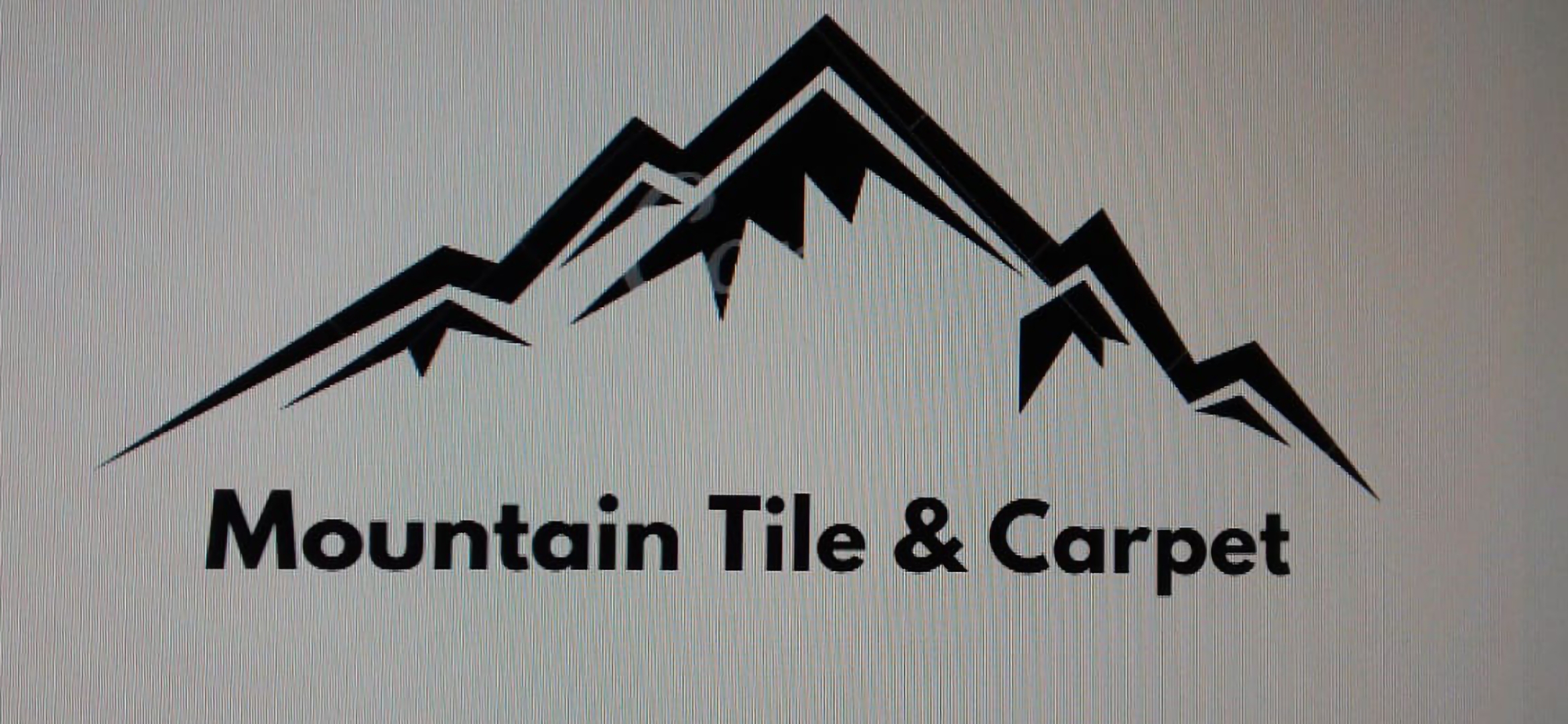 Mountain Tile & Carpet Logo