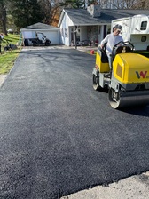 Tom Squires Blacktop Paving logo