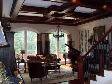 Traditional Living Room with dark wood and iron stair railing