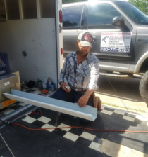 Economy Gutters LLC logo