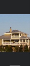 Re-Roofing America, LLC logo