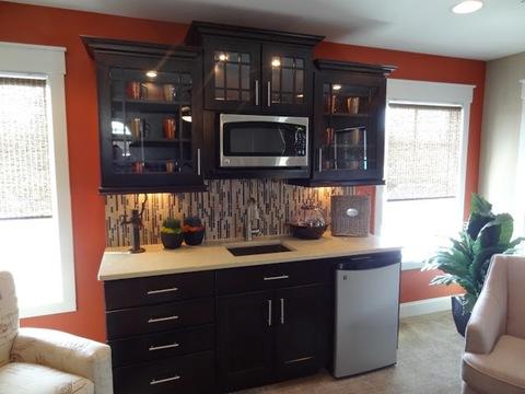 Eclectic Family Room with dark wood recessed panel cabinets
