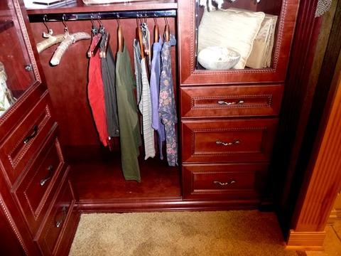 Traditional Closet with wood glass cabinets