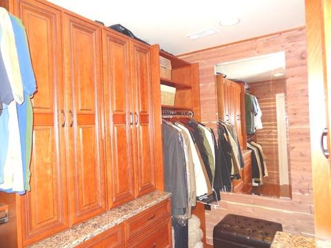 Traditional Closet with traditional lodge style master bedroom closet