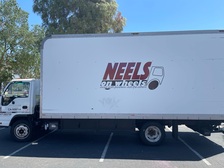 Neels On Wheels logo