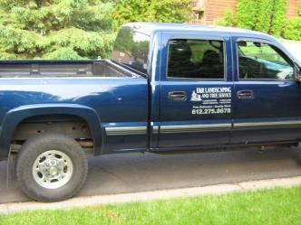 E & R Landscaping and Tree Service logo