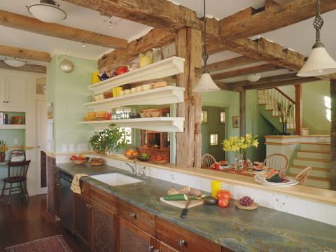 Eclectic Kitchen with light wood dining table and chairs