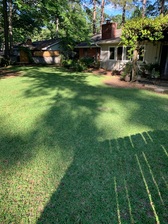 Logo for World Class Lawn Services