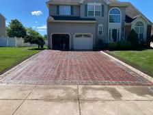 Quality Paving and Masonry logo